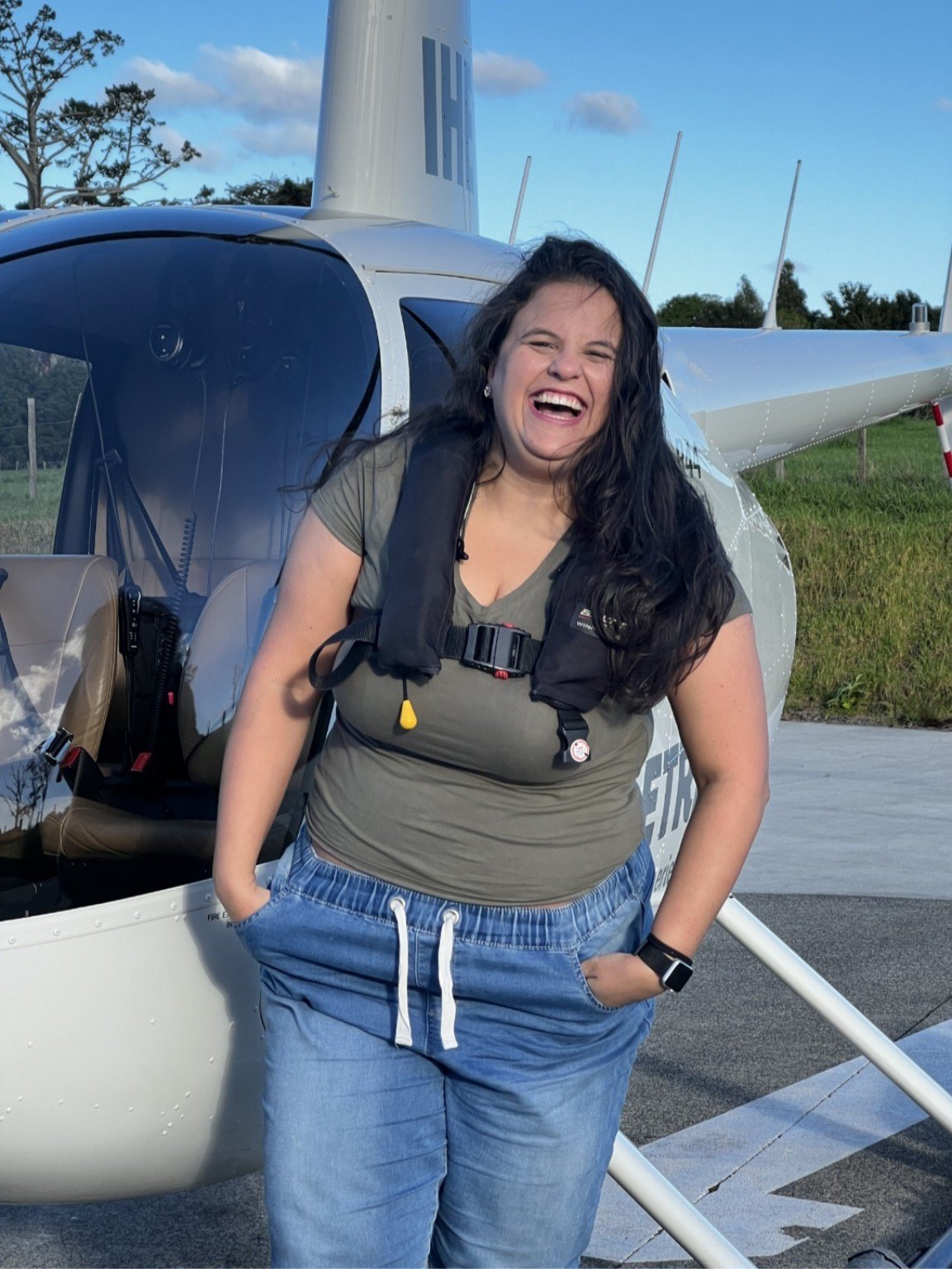 Isis Oliveira by a helicopter